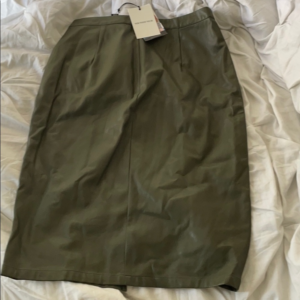 Faux leather green skirt .